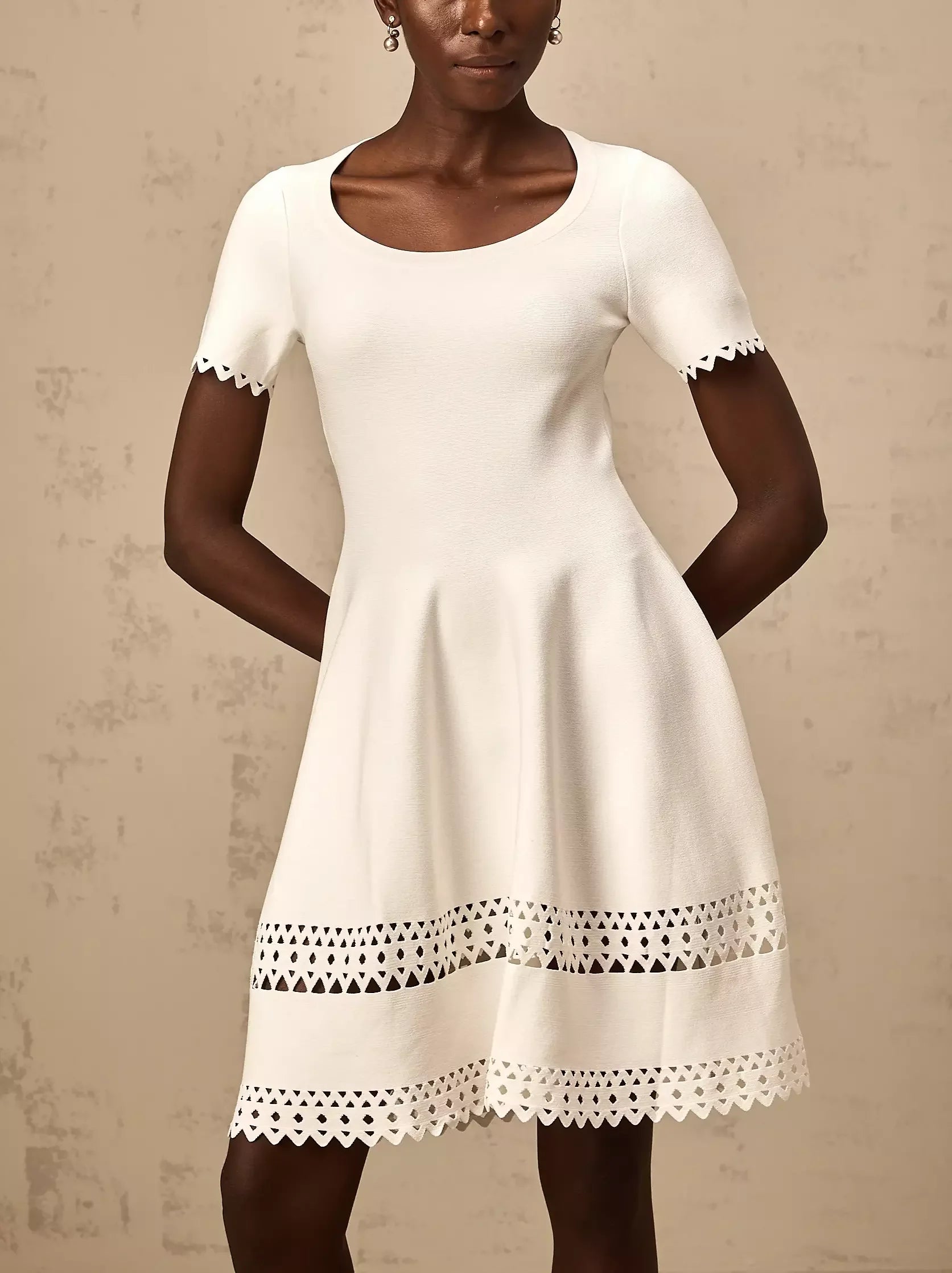White A-Line Cut-Out Stretch Knit Mini Dress with scalloped trim for a chic look