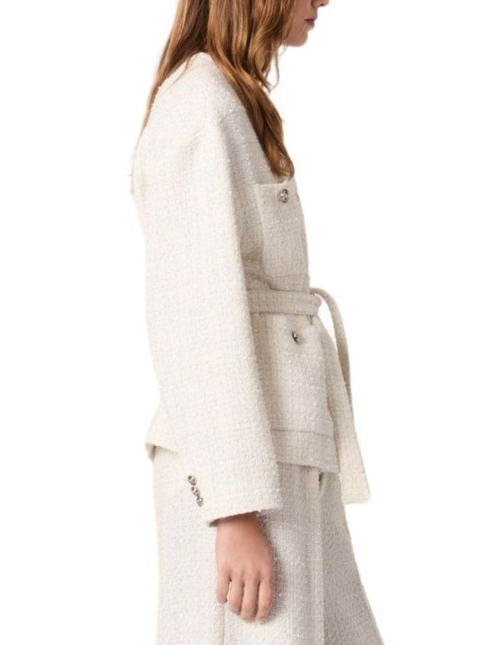 Cream-colored tweed jacket with belt from Branna Couture, a luxury women’s apparel piece