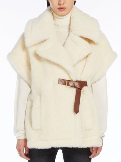 Cream-colored faux fur vest with brown leather belt in Belted Wool Teddy Gilet