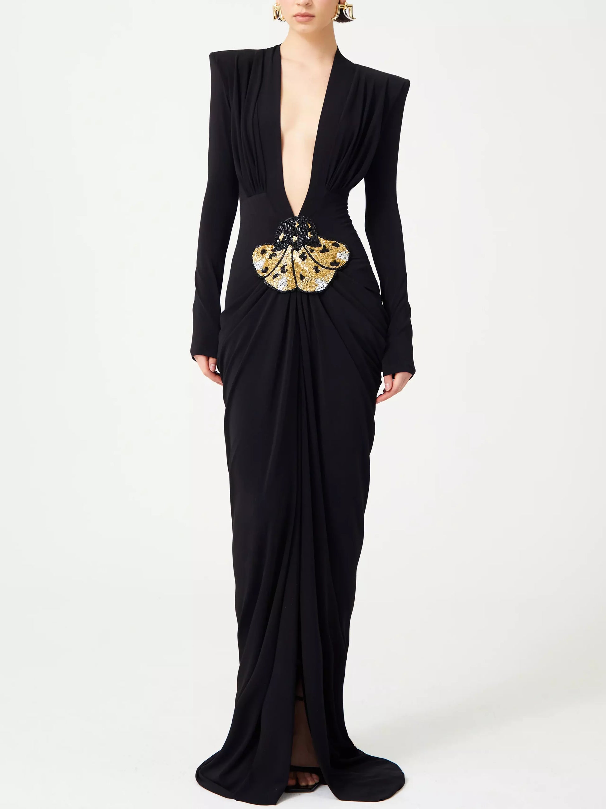 Black plunge-neck draped stretch gown featuring beaded patch embroidery and long sleeves