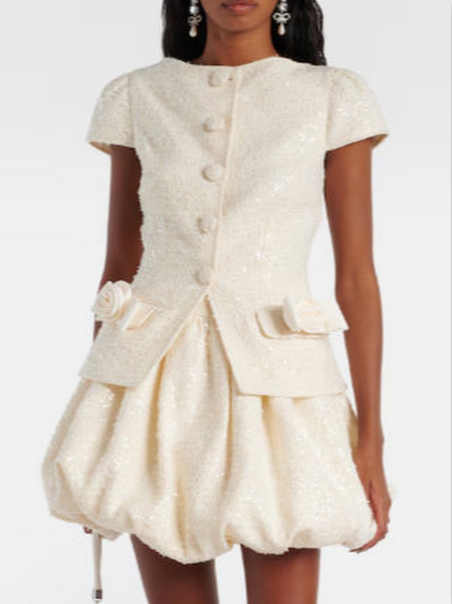 Cream-colored bouclé tweed mini dress with sequins, buttoned bodice, and bubble skirt