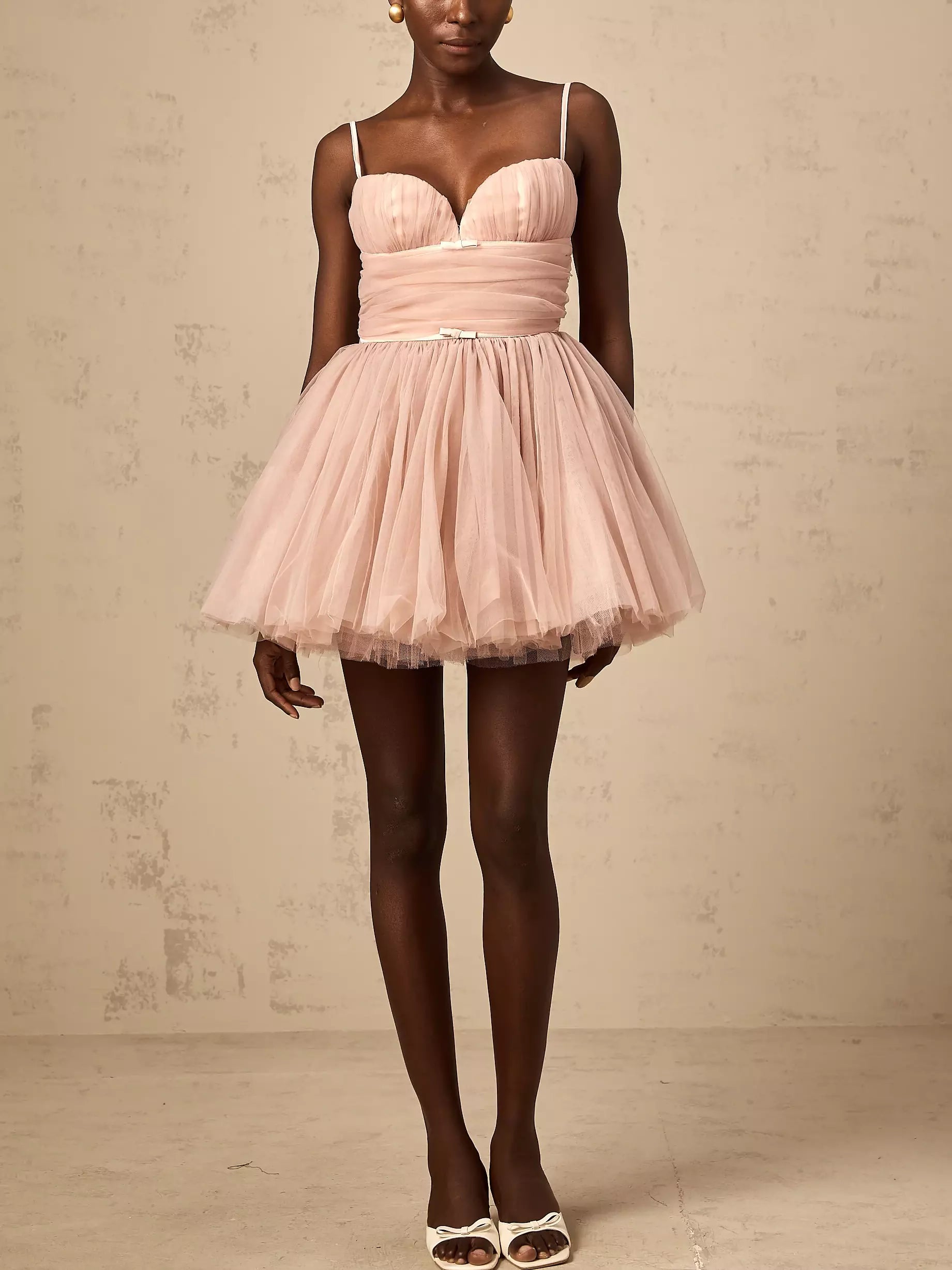Pink tulle flared mini dress with bow detail, perfect for summer outings and parties