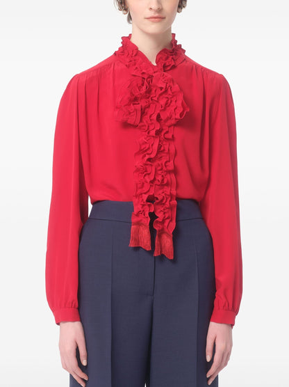 Bright Red Ruffled Collar Fringed Tie-Neck Shirt styled with navy pants for a chic look