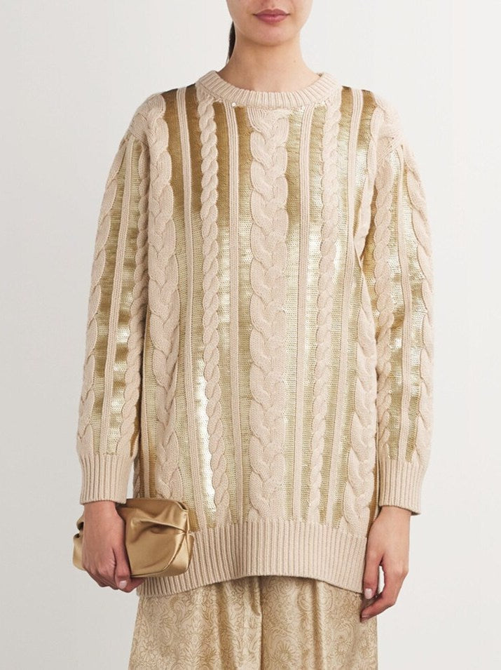 Beige Cable-Knit Sequin-Paneled Oversize Sweater with gold accents on display