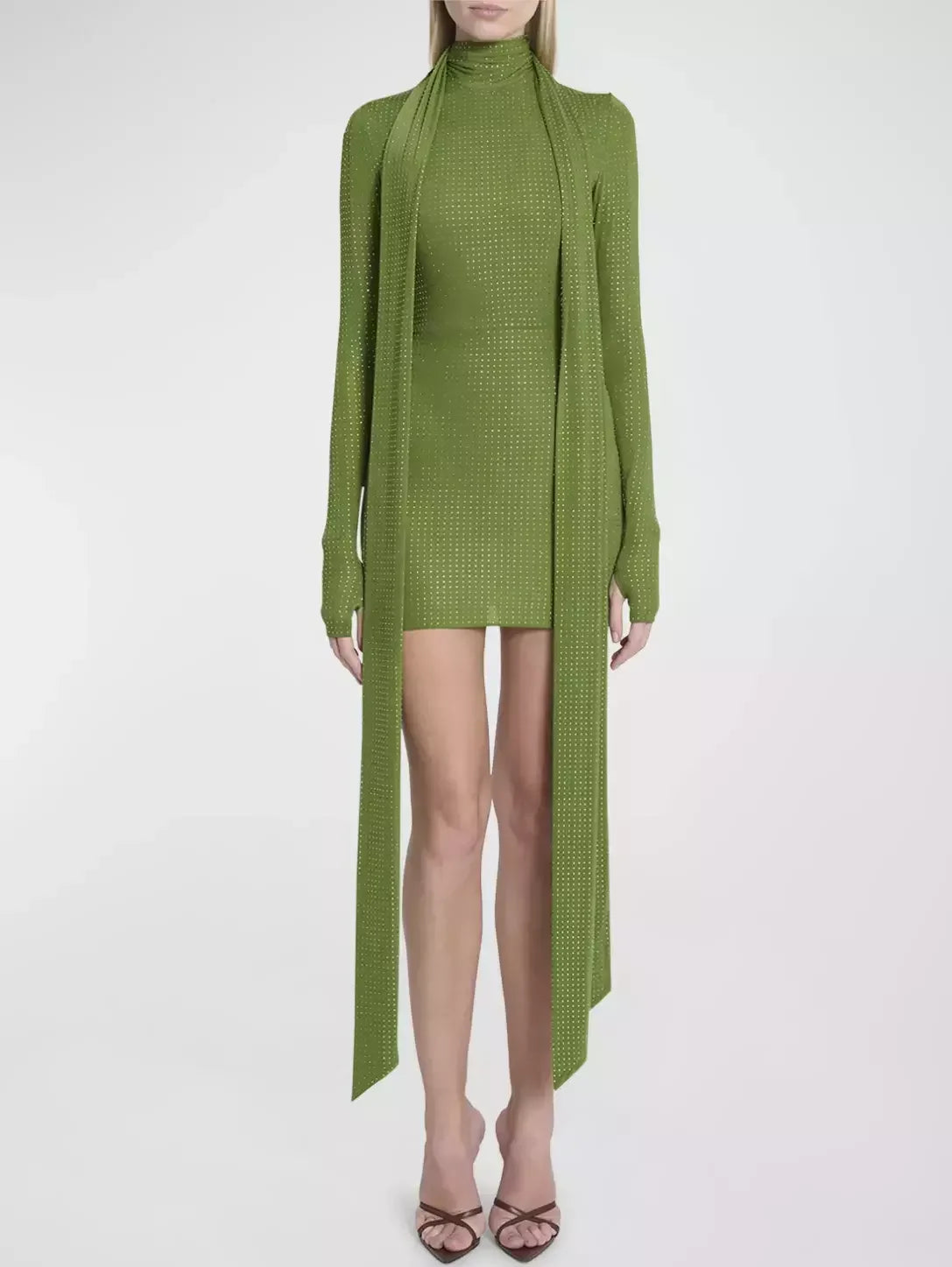 Green knit mini dress with attached scarf, featuring a crystal-embellished long sleeve scarf