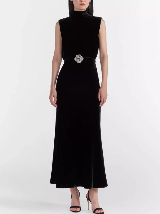 Sleeveless black velvet midi dress with embellished belt and crystal rose detail