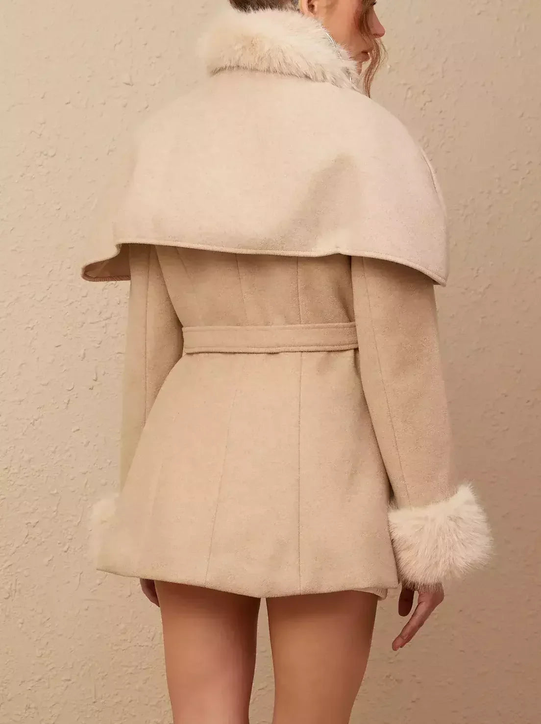 Beige belted faux-fur cape coat showcasing versatile style and detachable faux-fur cape