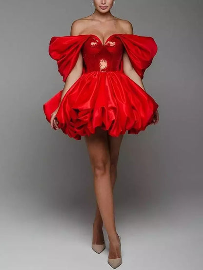 Draped off-the-shoulder red sequin fit and flared dress by Branna Couture