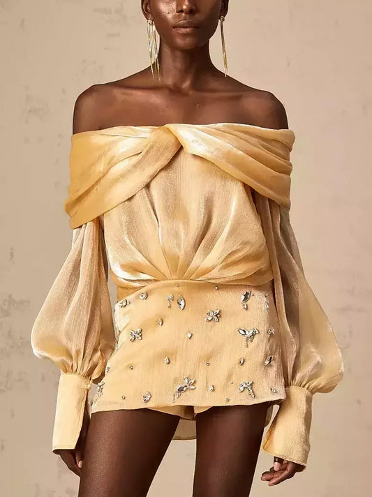Gold off-shoulder mini dress with rhinestone embellishments in luxurious satin