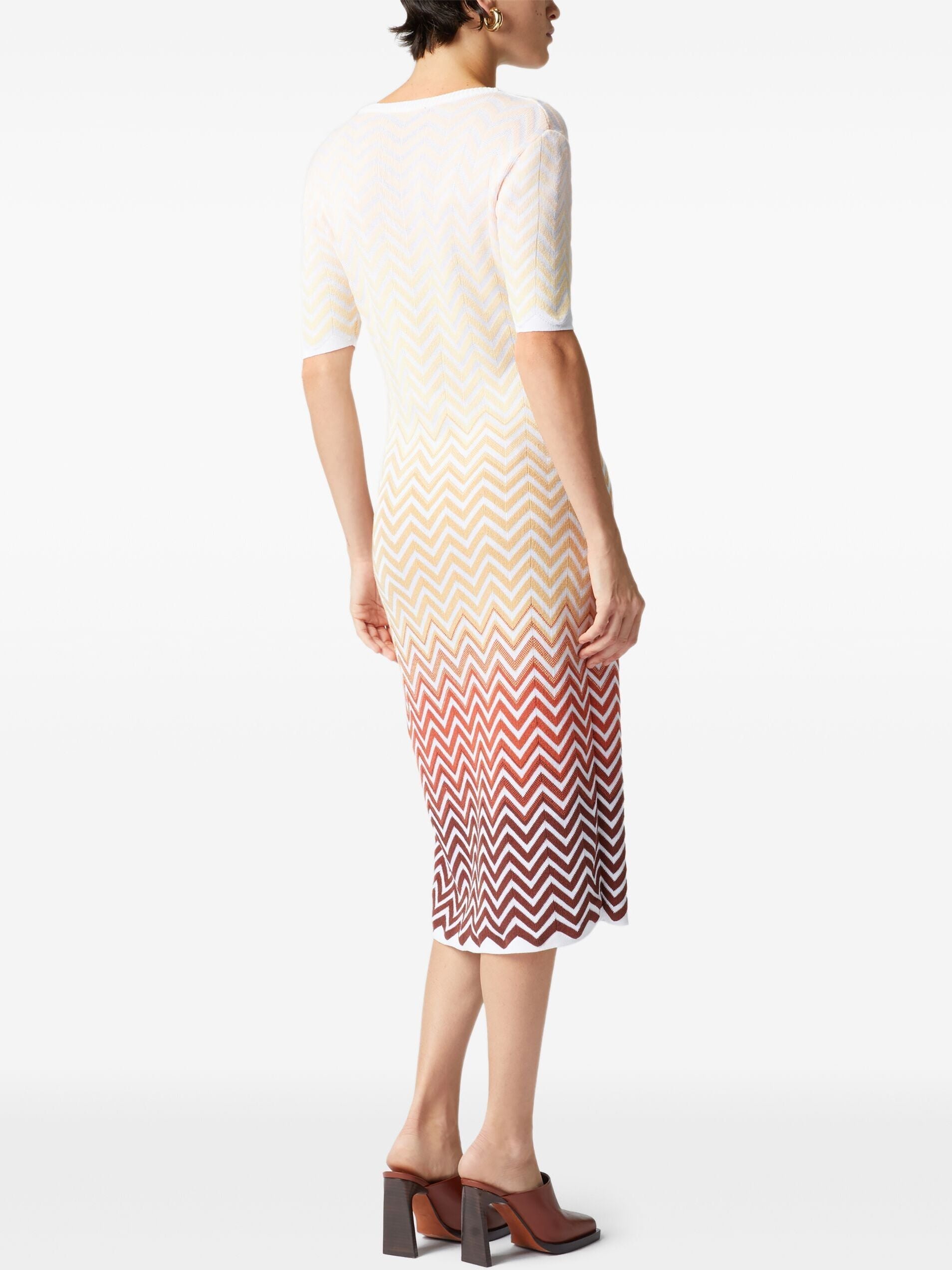 Woman in a Multicolor Zig-Zag Knit Dress showcasing a stylish chevron pattern