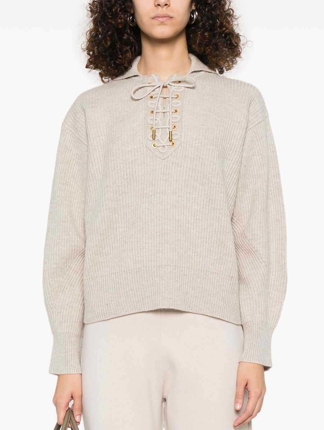 Beige ribbed eyelet lace-up knit sweater showcasing stylish lace-up detail