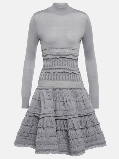 Gray long-sleeved ruffled paneled knit mini dress showcasing elegant style and comfort